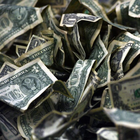 A pile of dollar bills.