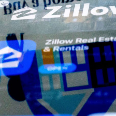 The Zillow website is reflected in the logo of the Zillow app, in Washington, DC, on February 15, 2023.