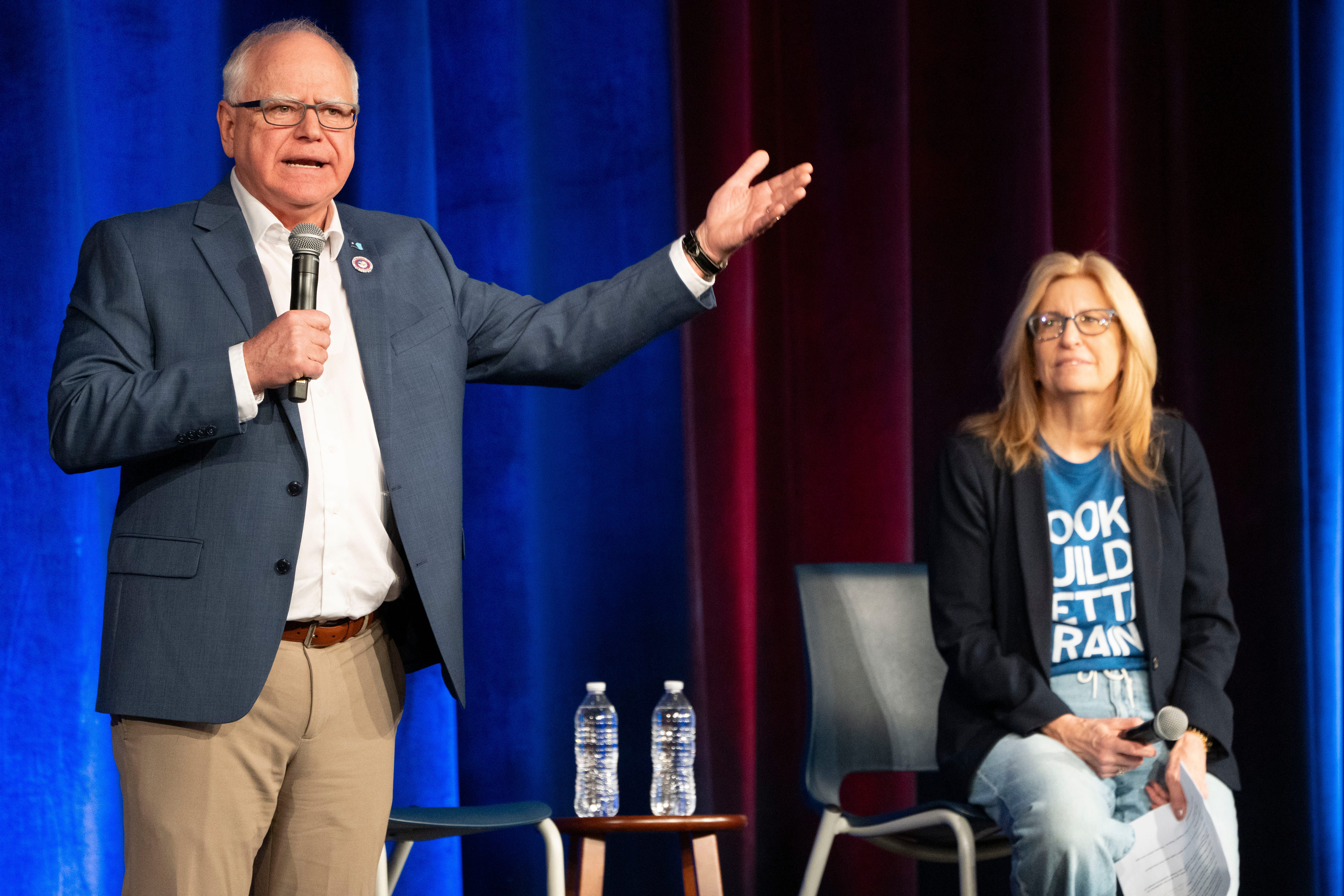 Minnesota Gov. Tim Walz, joined by Iowa Democratic Party Chair Rita Hart, speaks during a town hall at Roosevelt High School on Friday, March 14, 2025, in Des Moines.