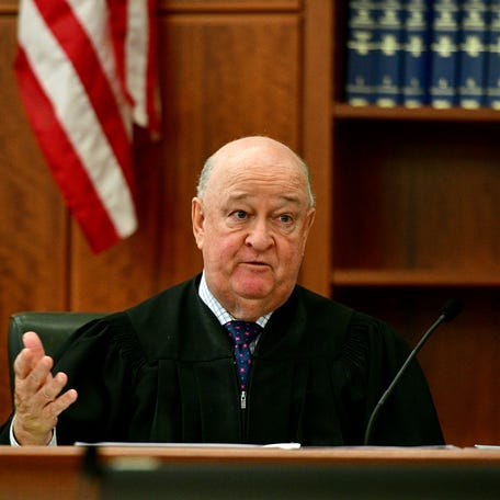 Judge Daniel Wrenn speaks with Yvonne Ngoiri, who plead guilty in the arson at 2 Gage St that led to the death of four people.