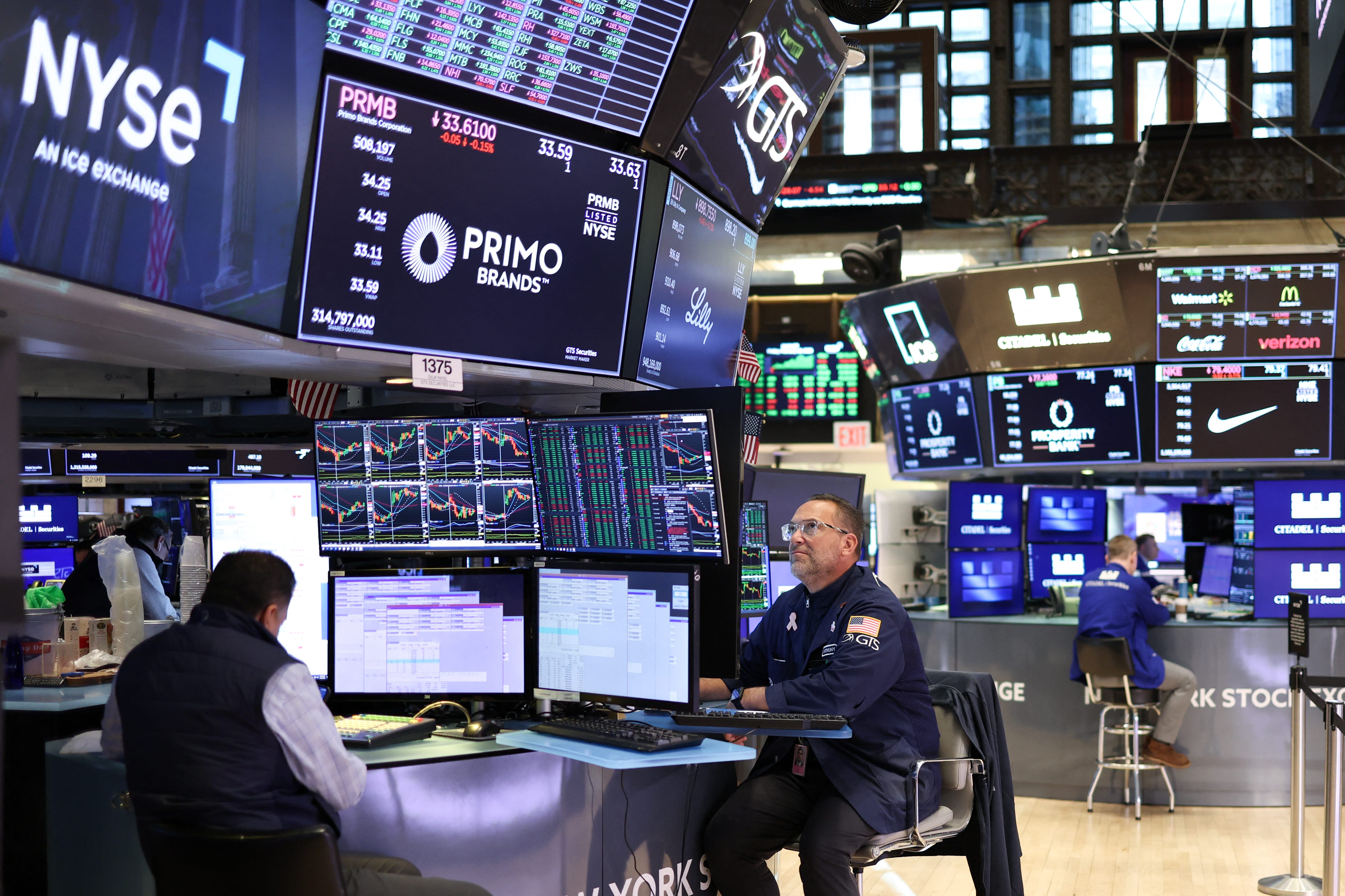 Traders work on the floor of the New York Stock Exchange (NYSE) in the Financial District in New York City on February 28, 2025. (Photo by CHARLY TRIBALLEAU / AFP) (Photo by CHARLY TRIBALLEAU/AFP via Getty Images)