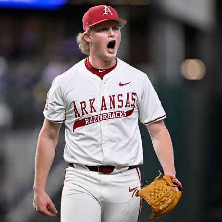 Feb 23, 2025; Arlington, TX, USA; The Michigan Wolverines play the Arkansas Razorbacks during the Amegy Bank College Baseball Series presented by Kubota Weekend 2 at Globe Life Field. Mandatory Credit: Jerome Miron-Imagn Images