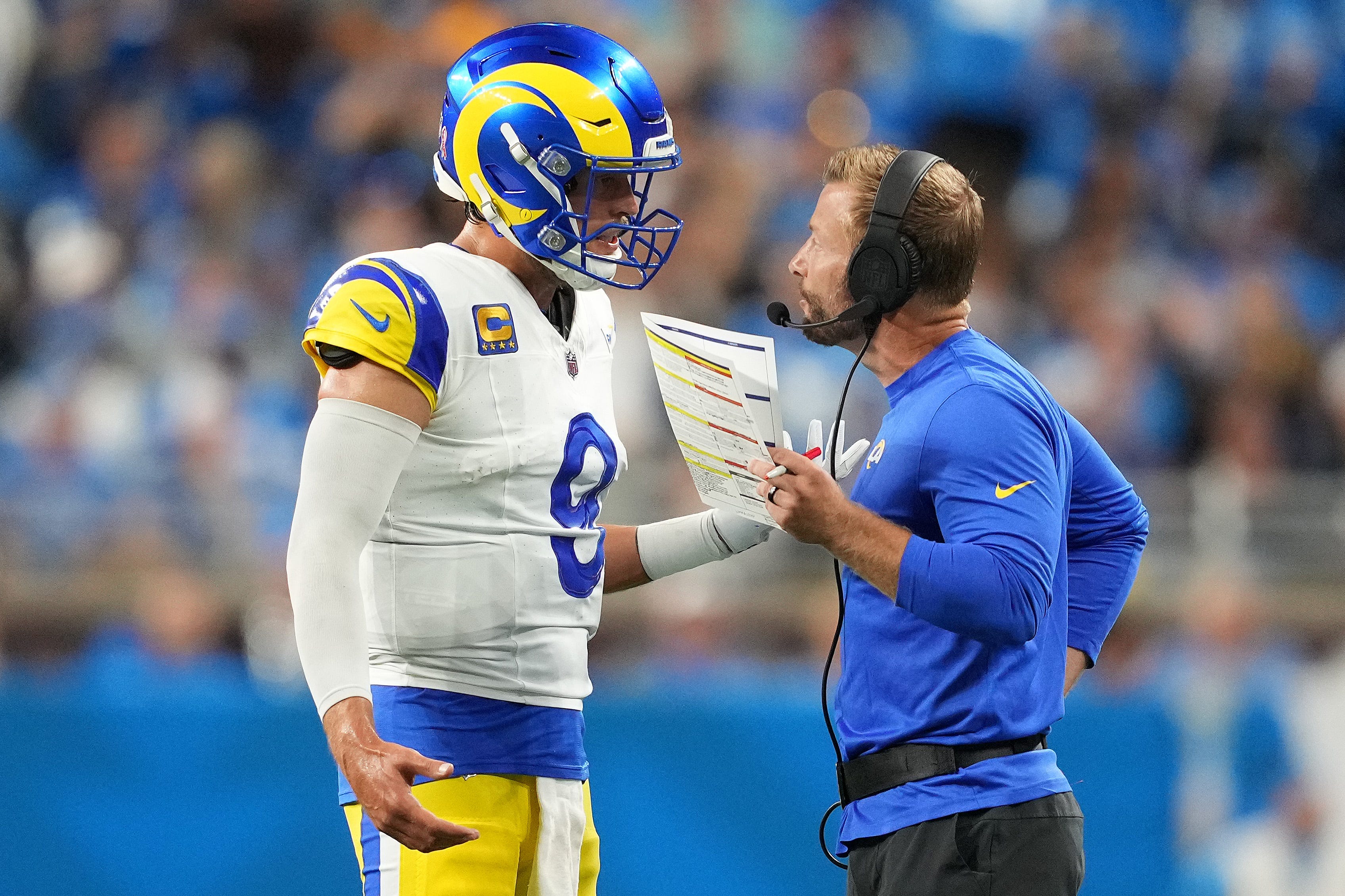 DETROIT, MICHIGAN - SEPTEMBER 08: Head coach Sean McVay of the Los Angeles Rams speaks with Matthew Stafford #9 during their game against the Detroit Lions at Ford Field on September 08, 2024 in Detroit, Michigan. (Photo by Nic Antaya/Getty Images)