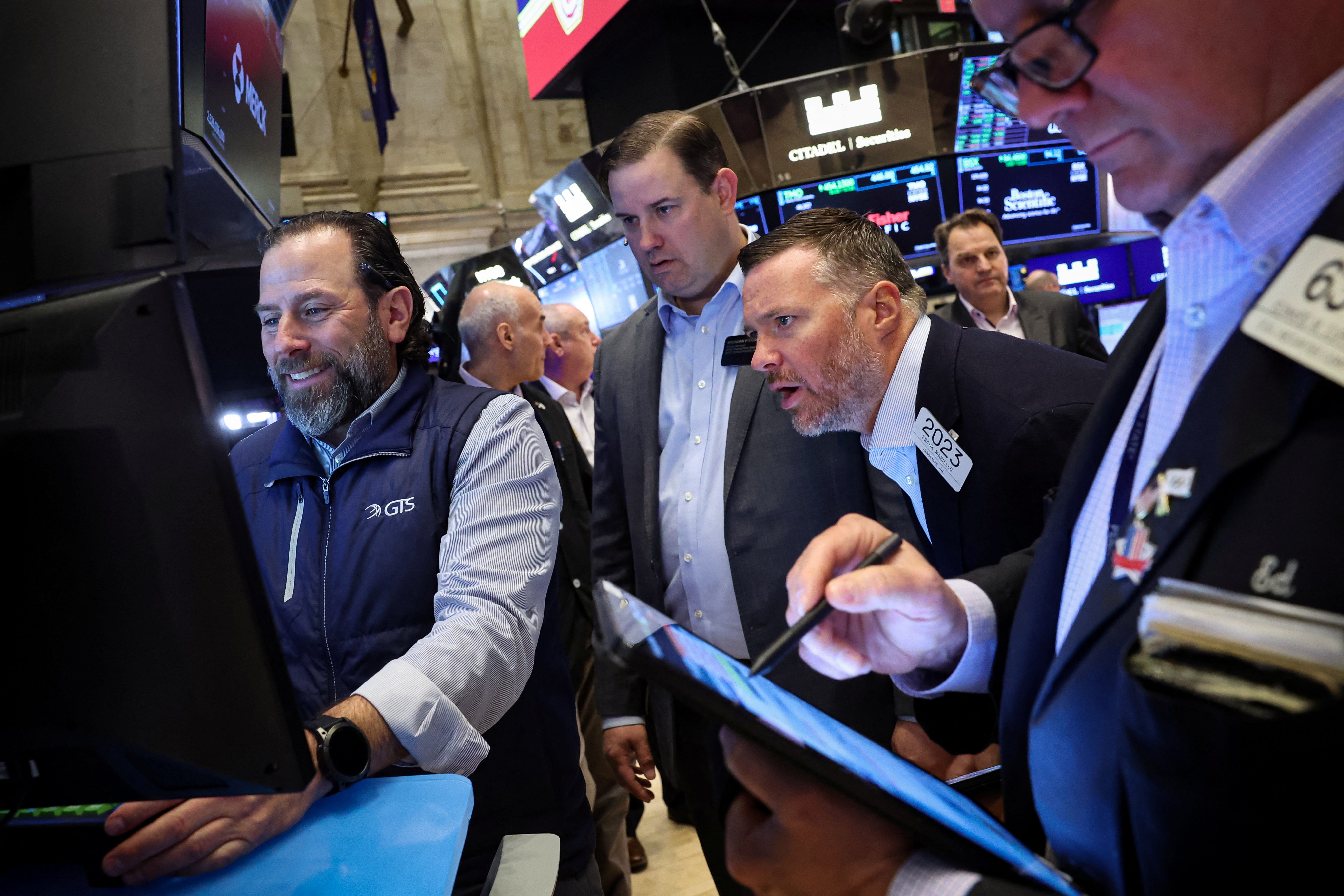 Traders work on the floor at the New York Stock Exchange on April 8, 2025.