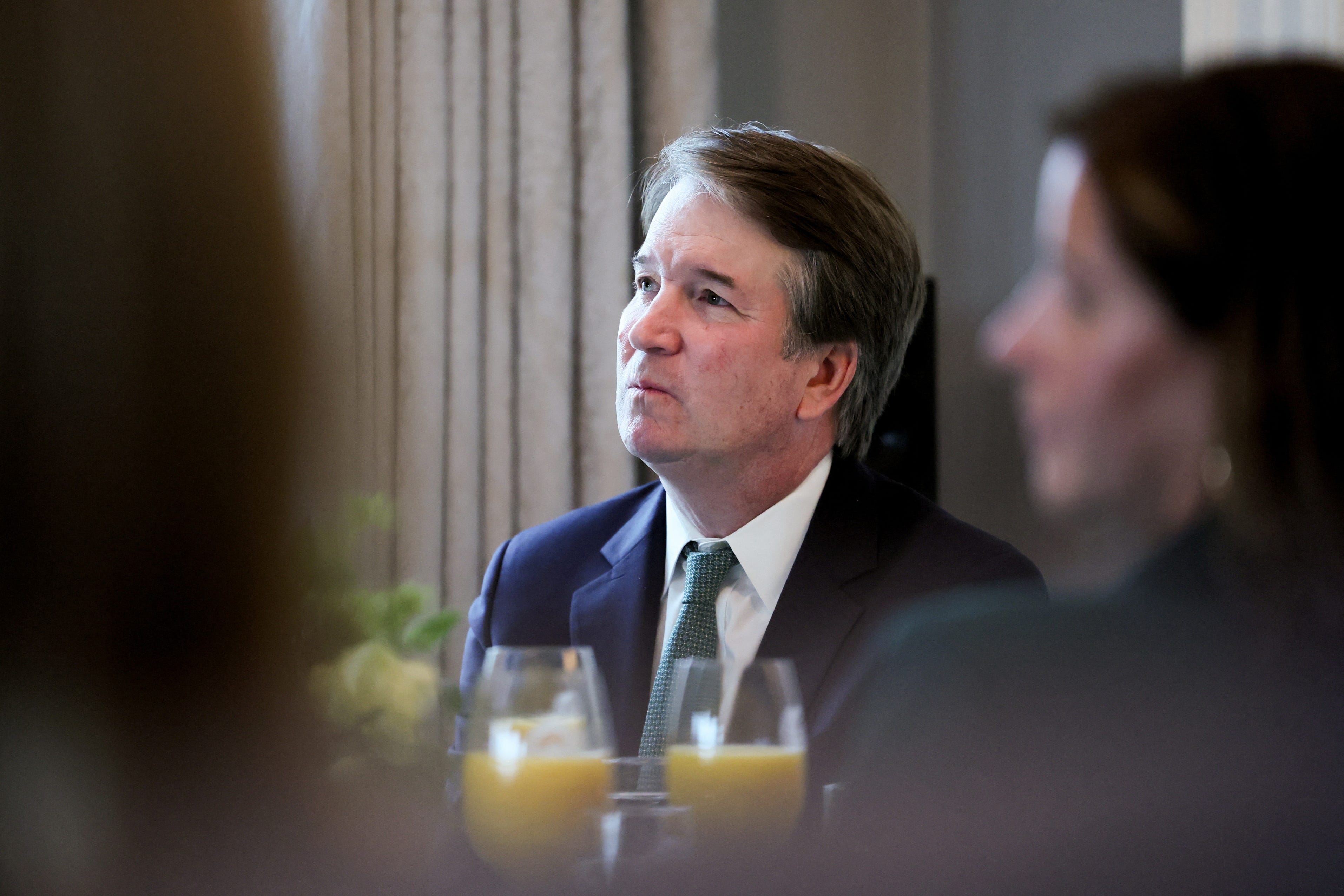 Supreme Court Justice Brett Kavanaugh is pictured listening to remarks at Vice President JD Vance's residence.