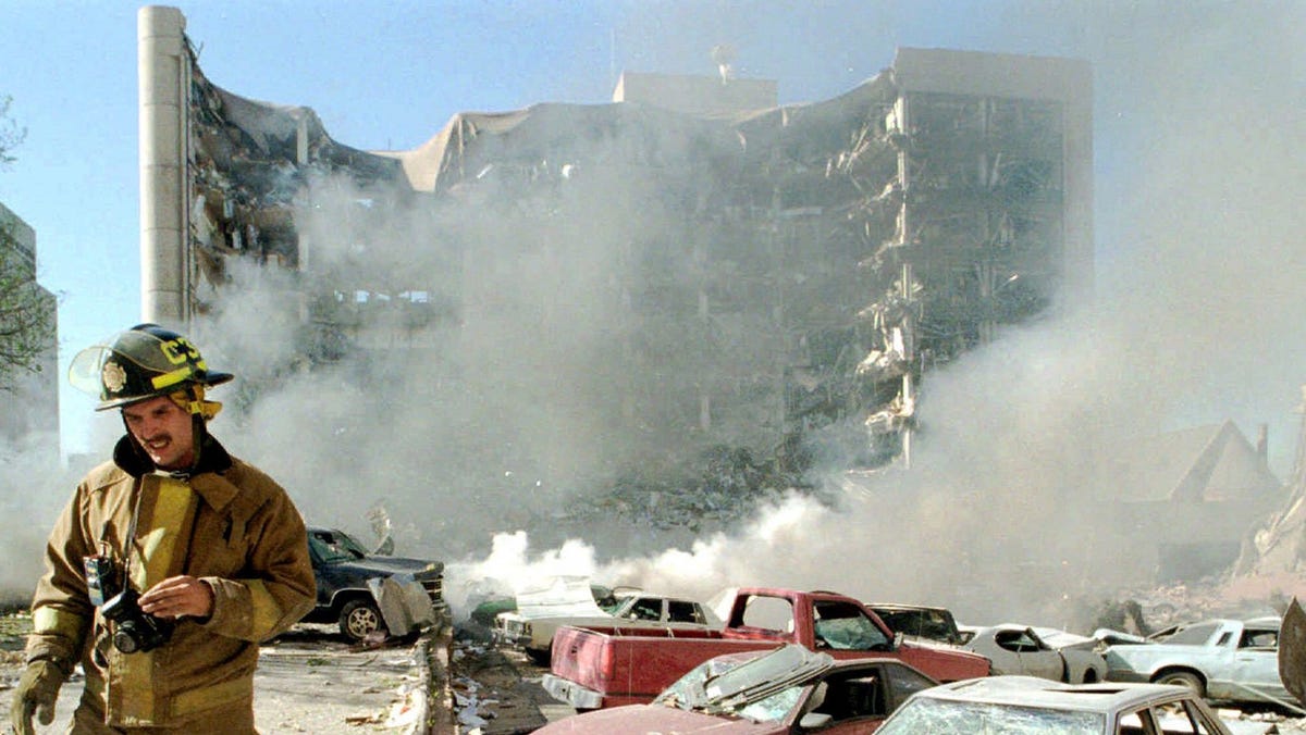 An Oklahoma City fireman is photographed walking on the north side of the Alfred P. Murrah Federal Building in Oklahoma City, following the explosion of a bomb on April 19, 1995.