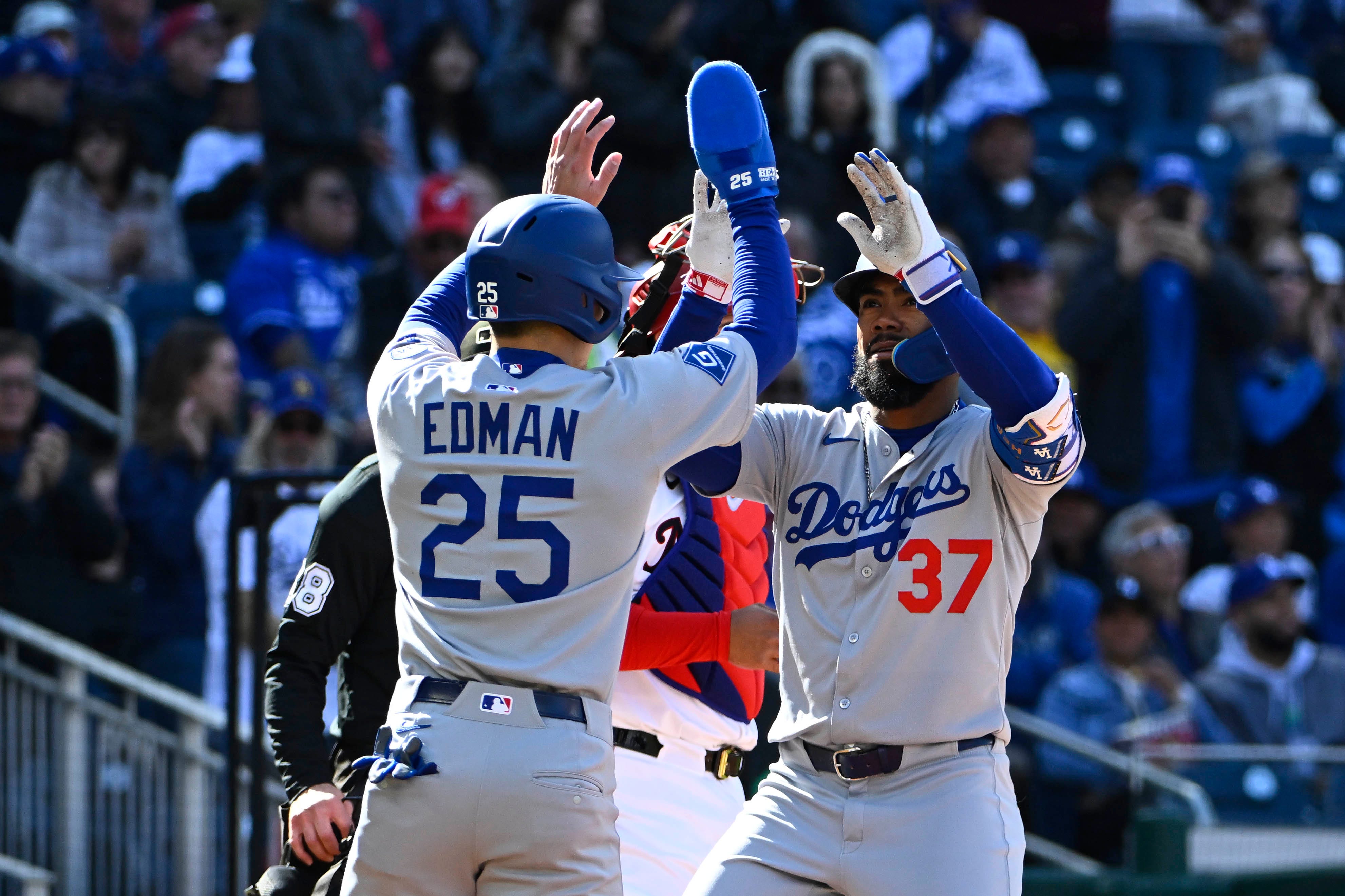 Los Angeles Dodgers outfielder Teoscar Hernández celebrates his two-run homer with Tommy Edman.
