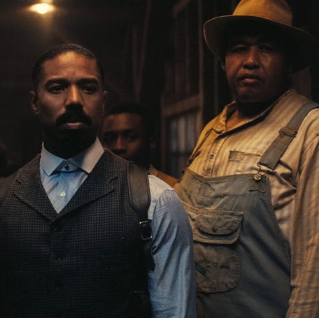 Smoke (Michael B. Jordan, center), flanked by brother Stack (also Jordan) and pal Cornbread (Omar Benson Miller), is wary of uninvited guests in the period horror film "Sinners."