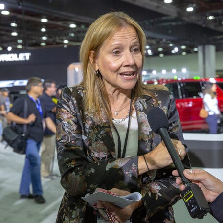 General Motors CEO Mary Barra speaks to reporters while she waits for the arrival of President Joe Biden at media day of the North American International Auto Show in Detroit, Michigan, September 14, 2022.