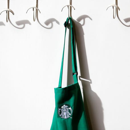 A barrista's apron hangs on a peg in Starbucks' Mayfair Vigo Street branch in central London on Sept. 12, 2012.