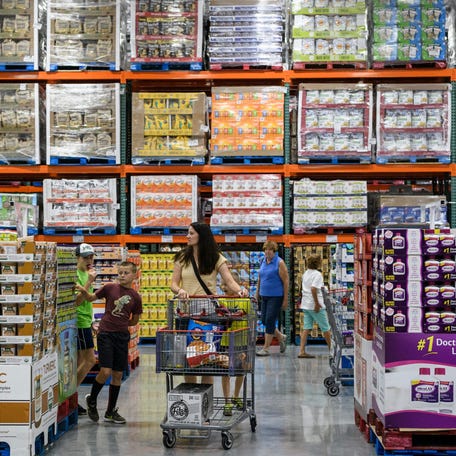 Costco members browse the aisles during the store's grand opening day in Evansville, Friday, June 28, 2019.
