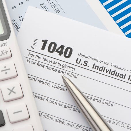 Close up of a Tax return form with calculator