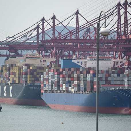 Container ships are seen docked at Kwai Chung Container terminal in Hong Kong on April 2, 2025. Asian markets edged up as nervous investors brace for US President Donald Trump's wave of tariffs later in the day, though speculation about what he has in store is stoking uncertainty on trading floors.