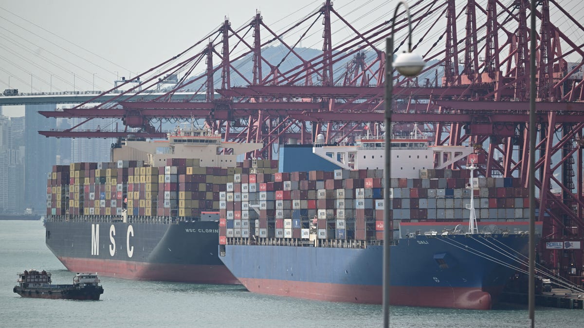Container ships are seen docked at Kwai Chung Container terminal in Hong Kong on April 2, 2025. Asian markets edged up as nervous investors brace for US President Donald Trump's wave of tariffs later in the day, though speculation about what he has in store is stoking uncertainty on trading floors.
