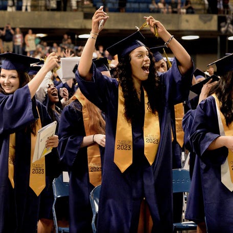 Southeast High School students celebrate as they turn their tassels from right to left on their mortarboards at graduation Saturday, June 3, 2023 at the Bank of Springfield Center.