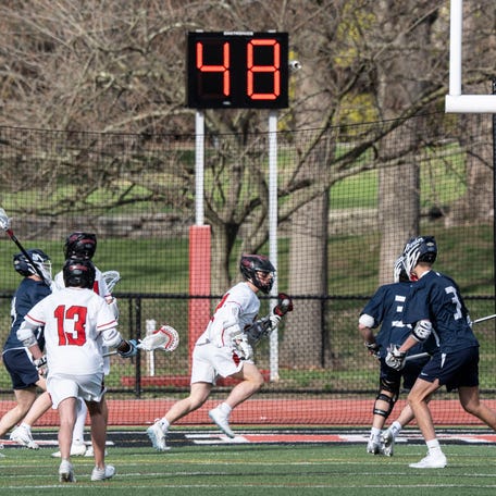 With the shot clock running, Rye controlled the ball during a varsity lacrosse game against Cold Spring Harbor at Rye High School April 16, 2025. Rye defeated Cold Spring Harbor 8-3.