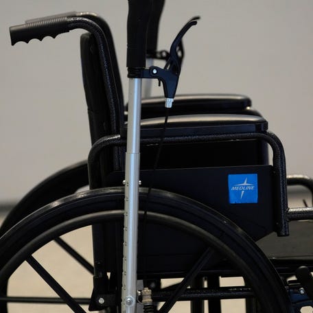 Mar 27, 2025; Augusta, Georgia, USA; A wheelchair is brought out for a demonstration during the WheelEasy pitch during the Augusta University Innovate 2025 pitch competition at the Georgia Cyber Innovation and Training Center. Mandatory Credit: Katie Goodale