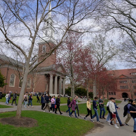 Students walk on the campus of Harvard University in Cambridge, Massachusetts, U.S., April 15, 2025.