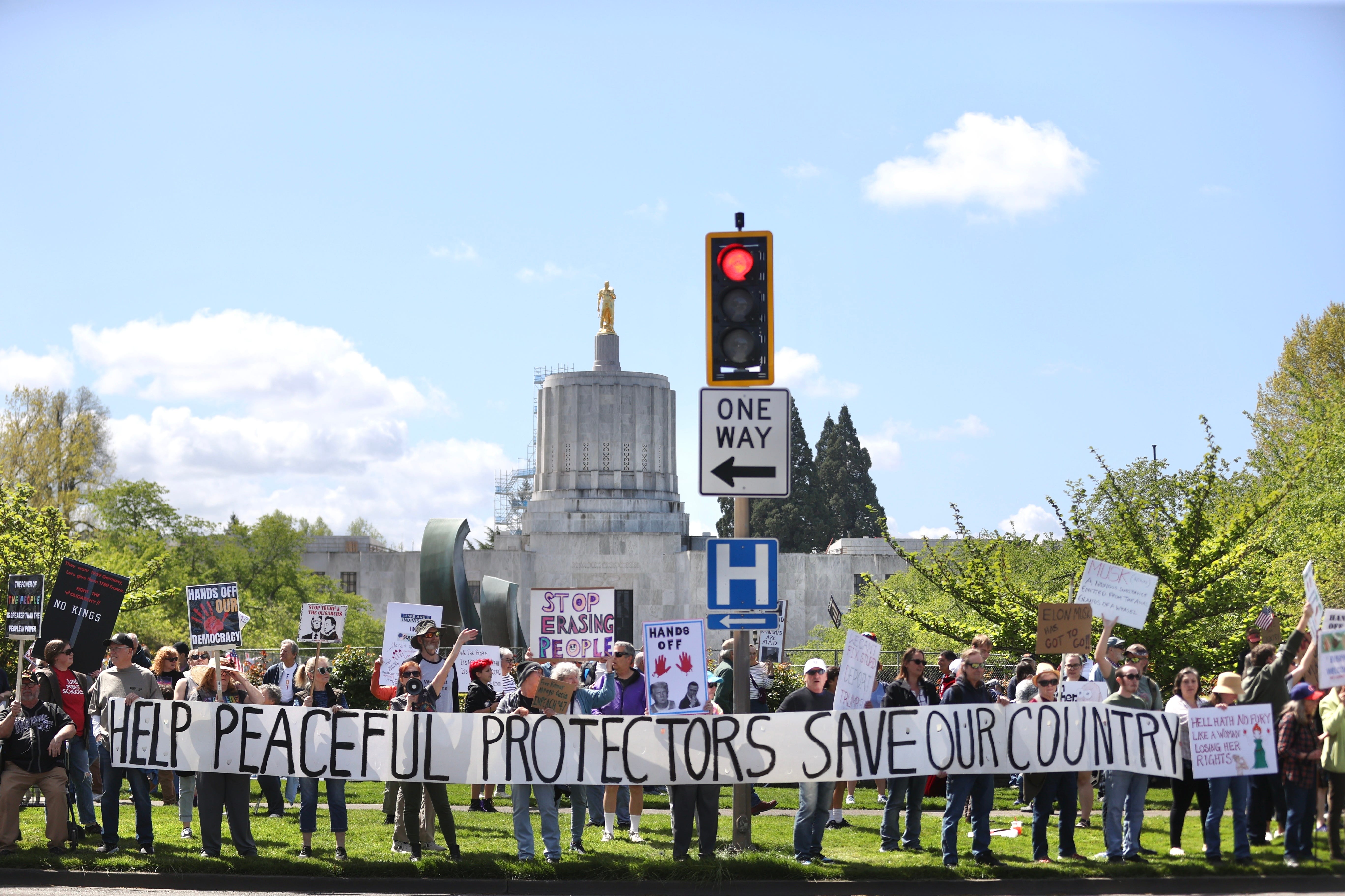 Rise & Resist protesters rally against President Donald Trump at Oregon State Capitol