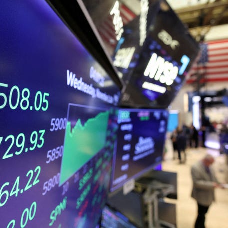 FILE PHOTO: A screen displays the Dow Jones Industrial Average at market close, after Republican presidential nominee Donald Trump became U.S. president-elect, at the New York Stock Exchange, in New York City, U.S., November 6, 2024.