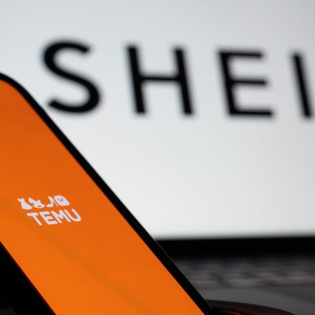 The Temu and Shein logos are displayed on screens on February 20, 2025 in London, England.