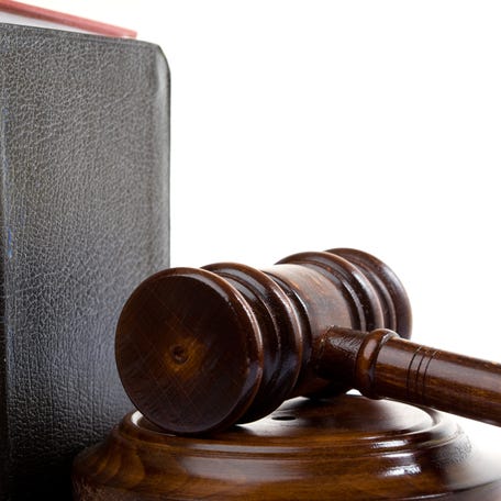 Gavel, Bible And Law Books On White Background
