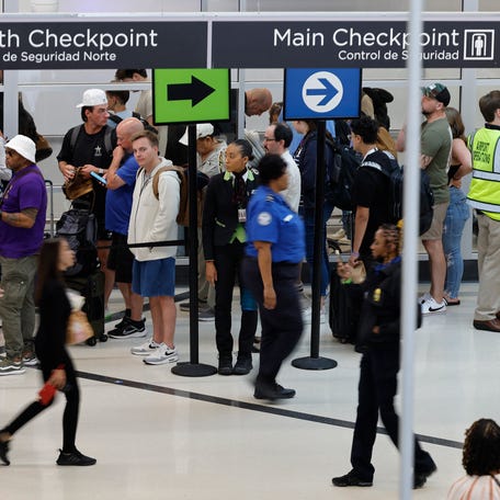 Travelers wait in a security checkpoint line at Hartsfield-Jackson Atlanta International Airport on June 28, 2024 in Atlanta, Georgia.