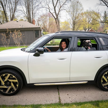 Detroit Free Press autos reporter Jamie L. LaReau with her two dogs in the 2025 MINI Countryman on Friday, April 18, 2025.