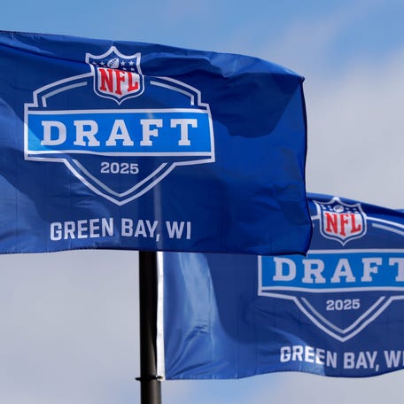 Flags promoting the 2025 NFL Draft pictured on April 19, 2025, at Leicht Memorial Park in Green Bay, Wis.