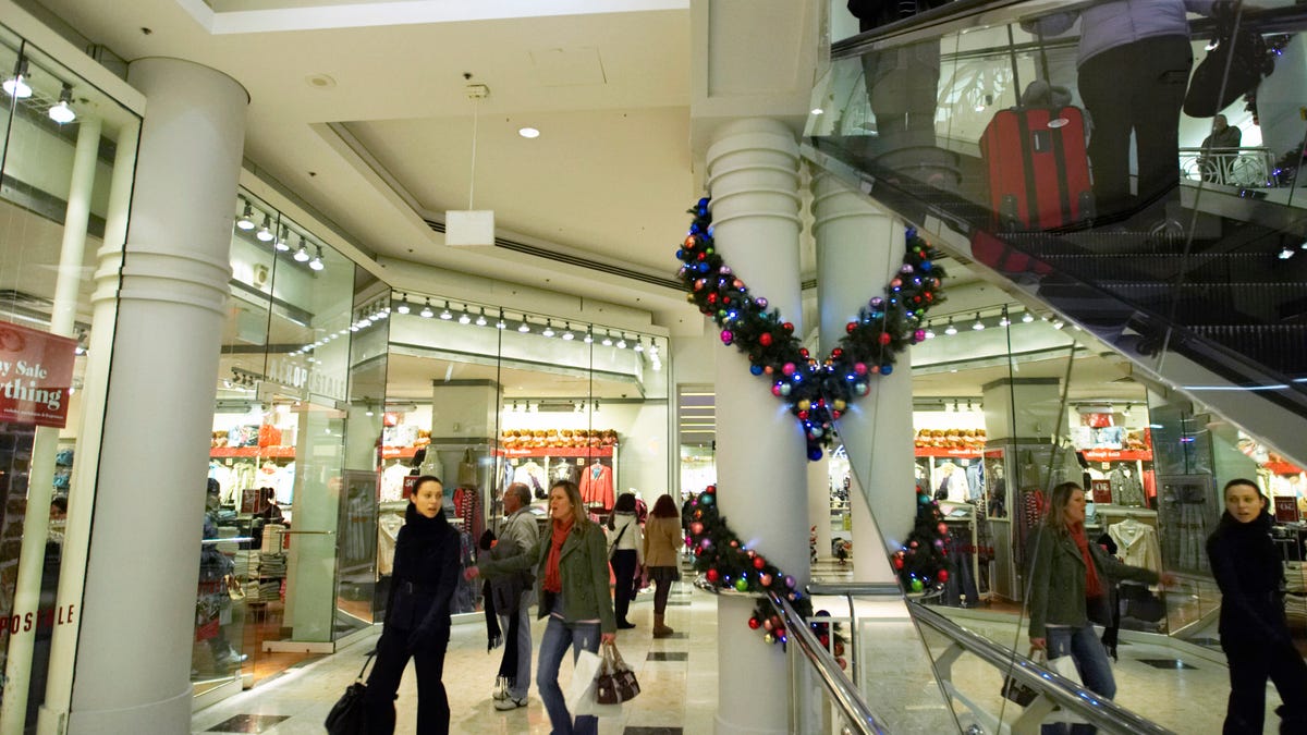 Shoppers walk through the Manhattan Mall in New York. Consumer spending has held up so far despite concerns about tariffs.