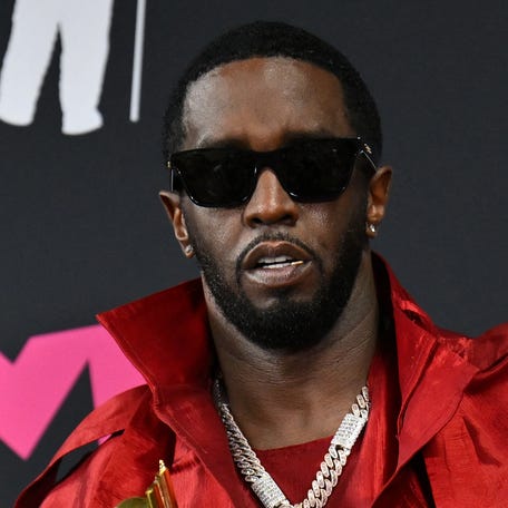 Sean "Diddy" Combs poses with the Global Icon award in the press room during the MTV Video Music Awards at the Prudential Center in Newark, New Jersey, on Sept. 12, 2023.