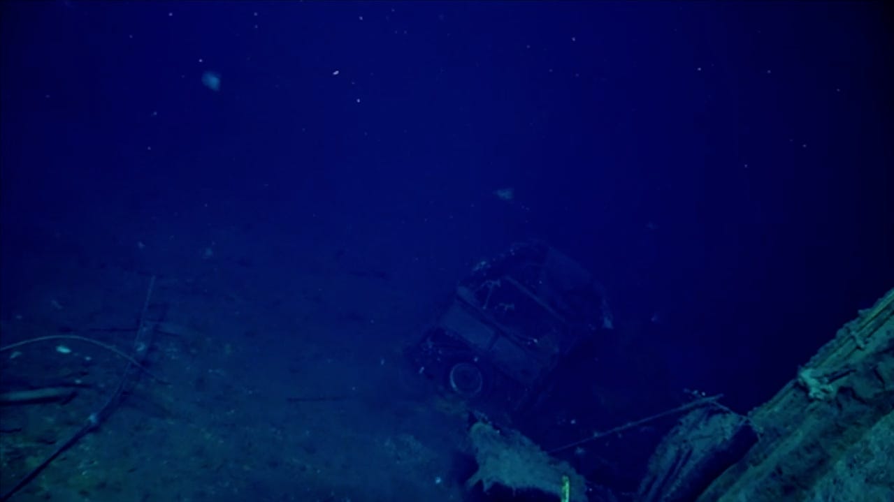 NOAA researchers discover mysterious car in sunken WWII aircraft carrier