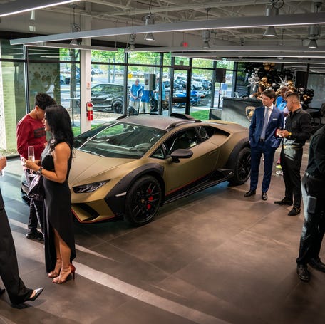 Guests check out the showroom during the grand opening of Lamborghini of Nashville in Brentwood, Tenn., Thursday, April 20, 2023.