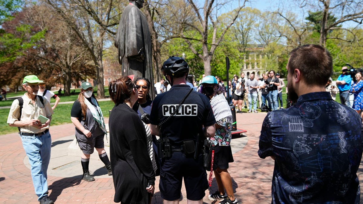 Ohio State Police intervene to stop the use of amplified speakers during a press conference for Ohio State University graduate student Ahwar Sultan on the Ohio State University Oval to discuss Sultan's legal battle against deportation. Sultan, one of at least 12 Ohio State international students who've had their visas revoked by the Trump administration, accuses the administration of targeting him for his participation in pro-Palestine protests last spring.
