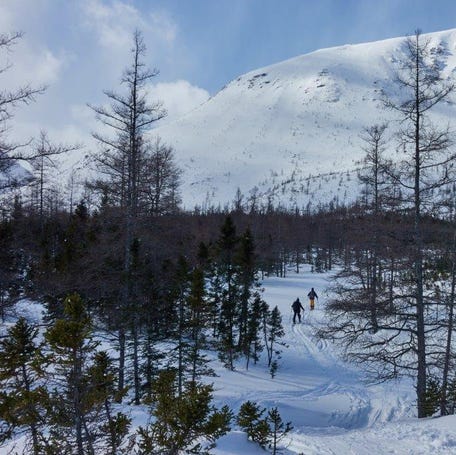 Backcountry skiers hike the Chic-Choc mountains in the region of GaspÃ©sie in Quebec, Canada, on March 2, 2019. - Sunny weather and cool temperatures allowed skiers to enjoy the March snow in this eastern region of Quebec where several meters of snow fall each year. (Photo by Julien BESSET / AFP)  (Photo credit should read JULIEN BESSET/AFP via Getty Images)