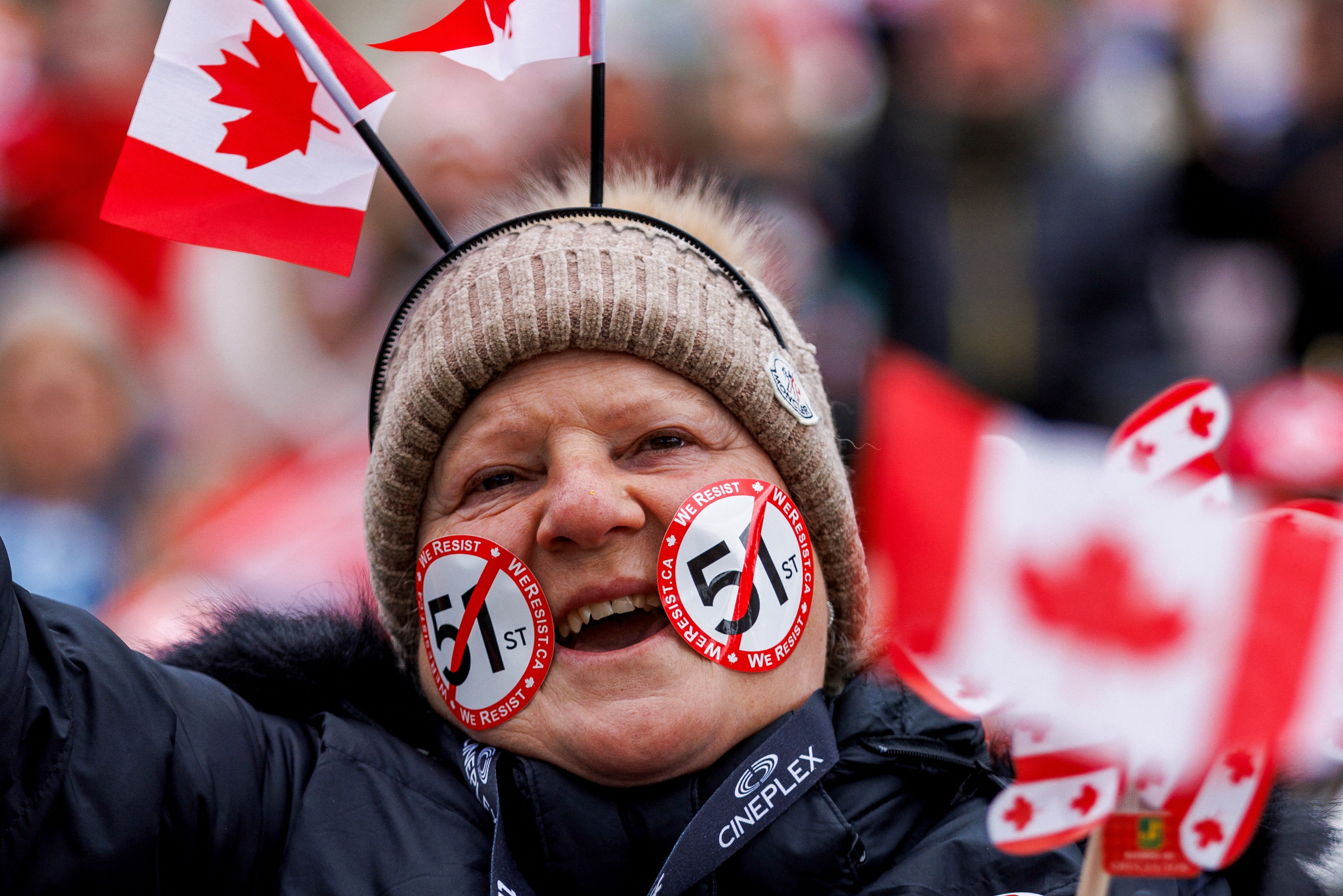 A person reacts as Canadians hold an "Elbows Up" protest against U.S. tariffs and other policies by U.S. President Donald Trump, at Nathan Phillips Square in Toronto, Ontario, Canada March 22, 2025.