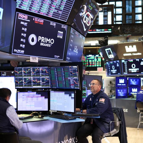 Traders work on the floor of the New York Stock Exchange (NYSE) in the Financial District in New York City on February 28, 2025. (Photo by CHARLY TRIBALLEAU / AFP) (Photo by CHARLY TRIBALLEAU/AFP via Getty Images)
