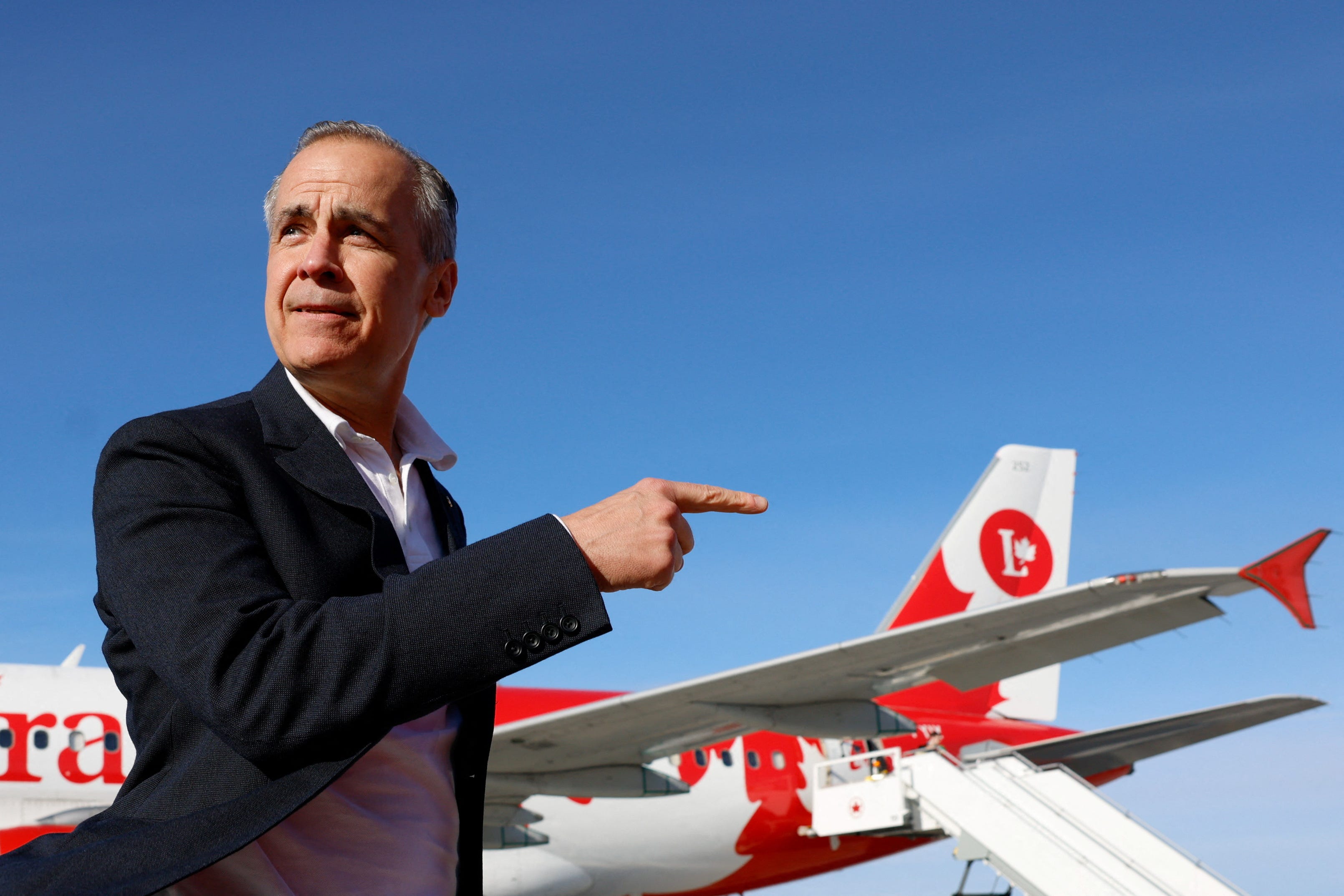 Canada's Prime Minister Mark Carney gestures at the Ottawa International Airport, during election day in Ottawa, Ontario, Canada, April 28, 2025.