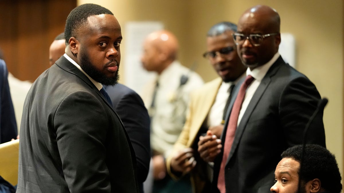 Former Memphis Police Officers Tedarrius Bean, left, and Demetrius Haley, right, two of three former Memphis officers charged with fatally beating Tyre Nichols in 2023, wait in the courtroom during a recess of their trial, Wednesday, April 30, 2025, in Memphis, Tenn. (George Walker IV/Pool)