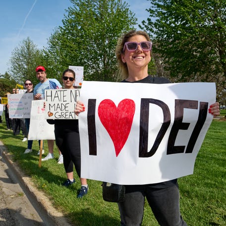 Hundreds protest outside a rally held byPresident Donald Trump at Macomb County Community College in Warren, MI, Tuesday, April 29, 2025 after his first 100 days in office.