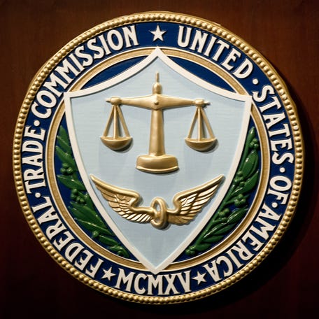The US Federal Trade Commission seal is seen during a press conference in Washington, DC on January 3, 2013.