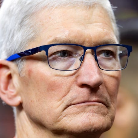 Apple CEO Tim Cook on the field before Super Bowl LIX between the Philadelphia Eagles and the Kansas City Chiefs at Ceasars Superdome.