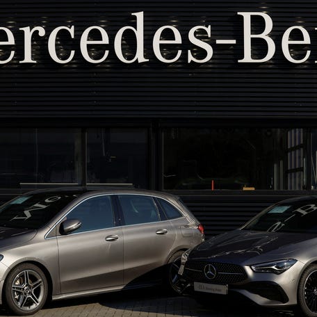 A Mercedes-Benz sign is seen outside a Mercedes-Benz car dealer in Arnhem, Netherlands February 18, 2025.
