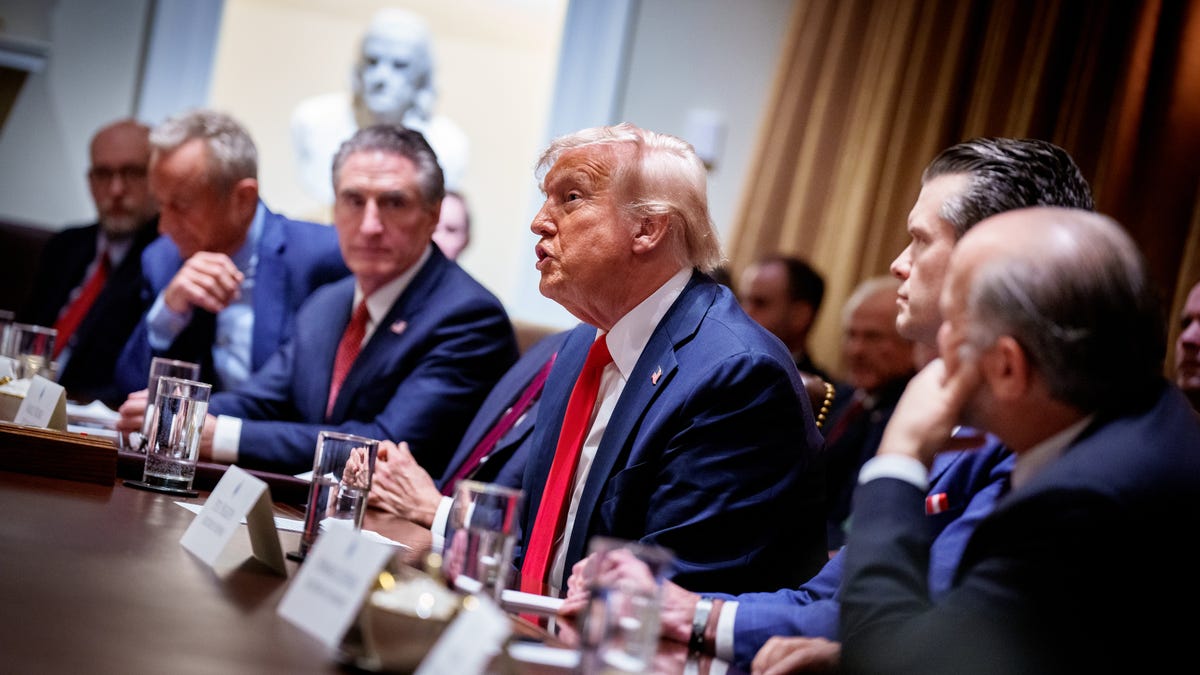 President Donald Trump, accompanied from left to right by Office of Management and Budget Director Russell Vought, Health and Human Services Secretary Robert F. Kennedy Jr., Interior Secretary Doug Burgum, Defense Secretary Pete Hegseth, and Commerce Secretary Howard Lutnick, speaks during a Cabinet meeting at the White House on February 26, 2025 in Washington, D.C.