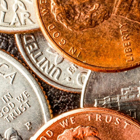 United States currency coins used in daily purchases.