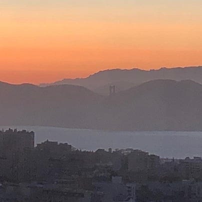 A panoramic view of the Golden Gate Bridge at sunset taken from the Hilton's skybar at Union Square on July 14, 2022.
