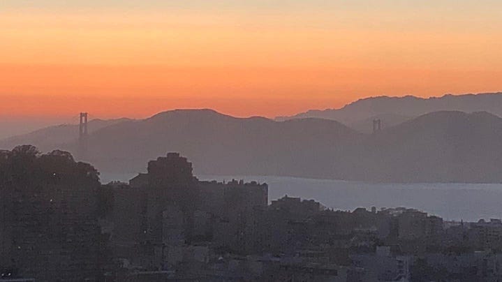 A panoramic view of the Golden Gate Bridge at sunset taken from the Hilton's skybar at Union Square on July 14, 2022.