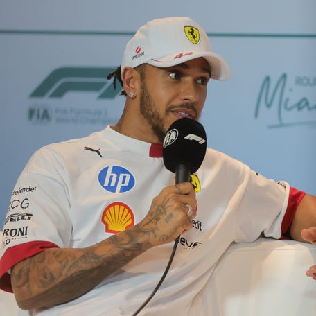 Ferrari driver Lewis Hamilton (44) talks to reporters during a press conference at Miami International Autodrome.