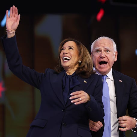 Democratic presidential nominee Kamala Harris and running mate Tim Walz celebrate during the final day of the Democratic National Convention on Aug. 22, 2024, in Chicago.