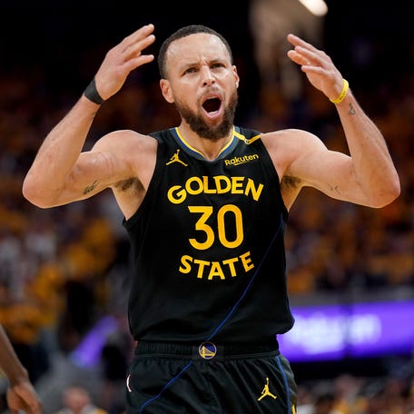 Warriors guard Stephen Curry reacts after being fouled in the third quarter of Game 6 against the Rockets.